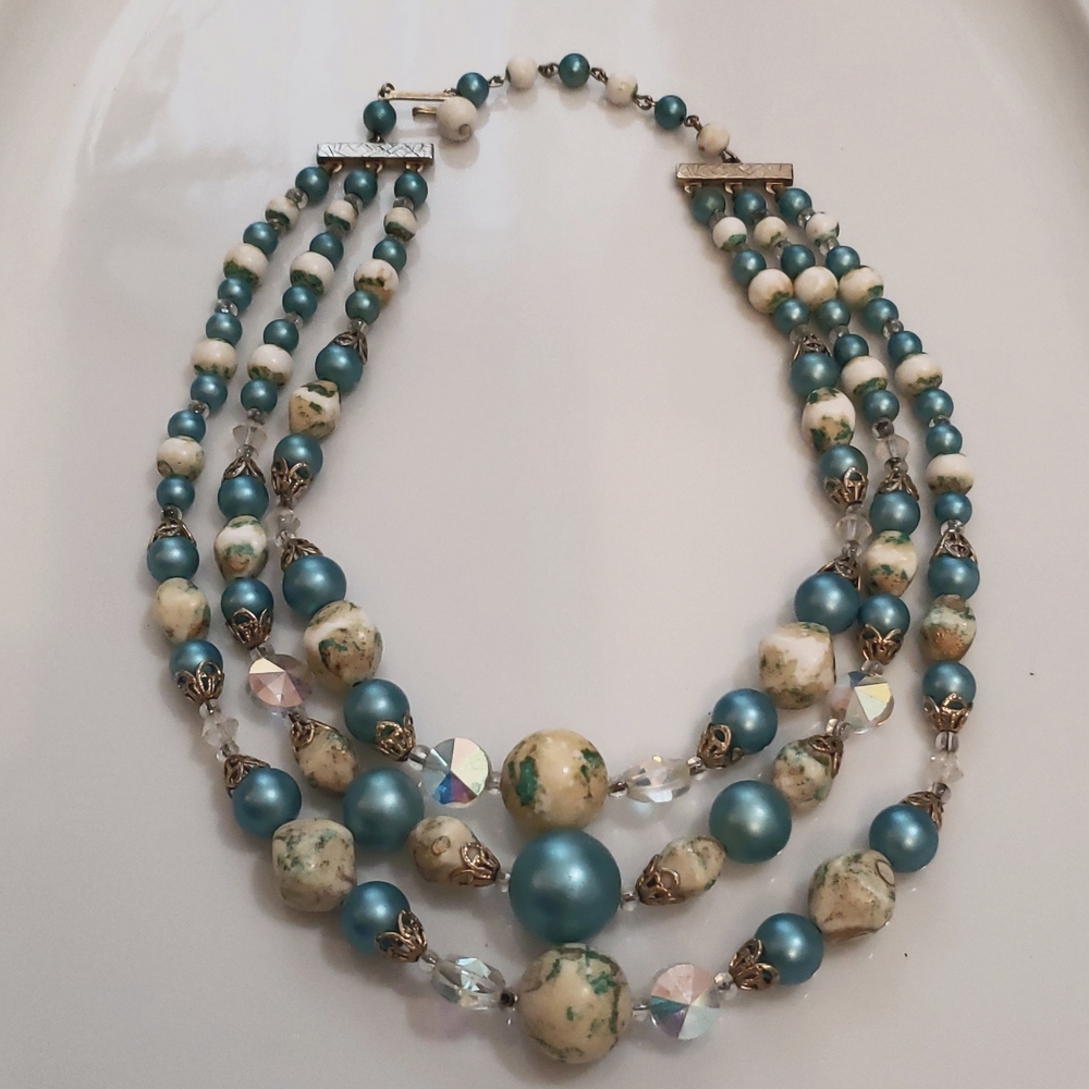 Textured Necklace with turquoise blue and creamy ivory with gold highlights.